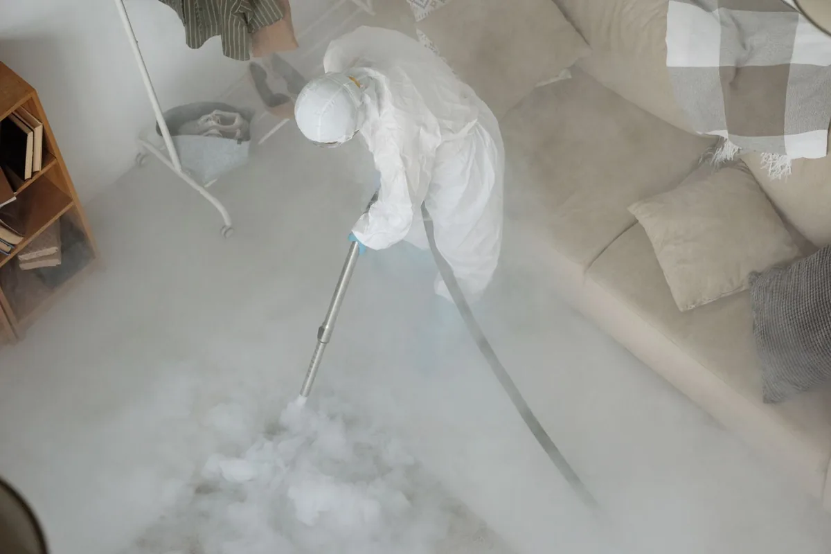 Biohazard cleanup technician in protective equipment, Dollar Bay, MI